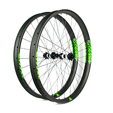 Hand-built carbon mountain bike 29er plus wheels 50mm wide beadless tubeless compatible